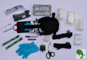 Trauma kit opened with contents spread around it to view