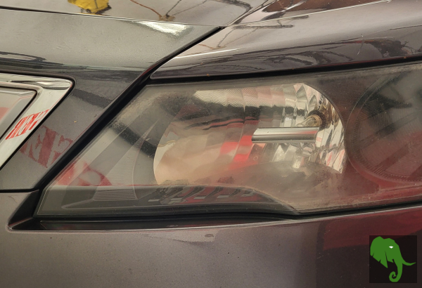 Driver's side headlight on car