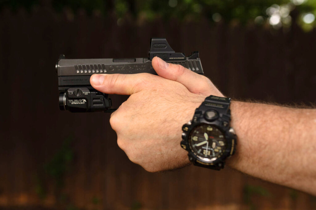 CZ P10C pistol with strong, 2-handed grip