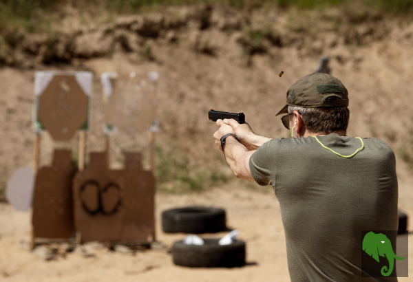 Gentleman at outdoor range first a semi-automatic pistol