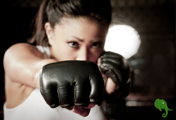 Woman punching towards camera