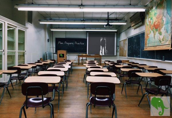 Classroom with "Plan, Prepare, Practice" upfront on the chaulkboard and a presentation on overhead projector