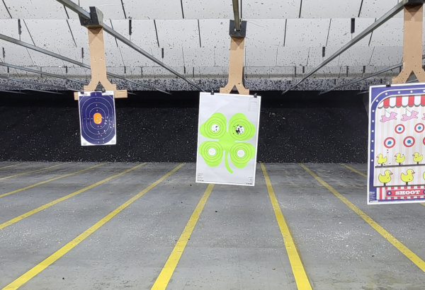 shot up paper targets on a gun range