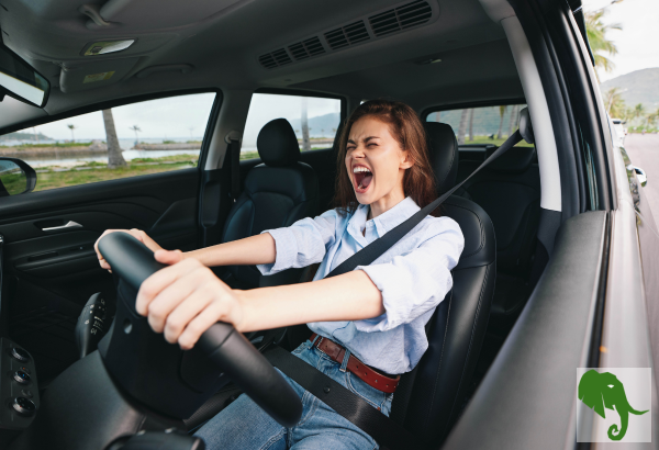 Woman upset and yelling in the driver's seat of vehicle